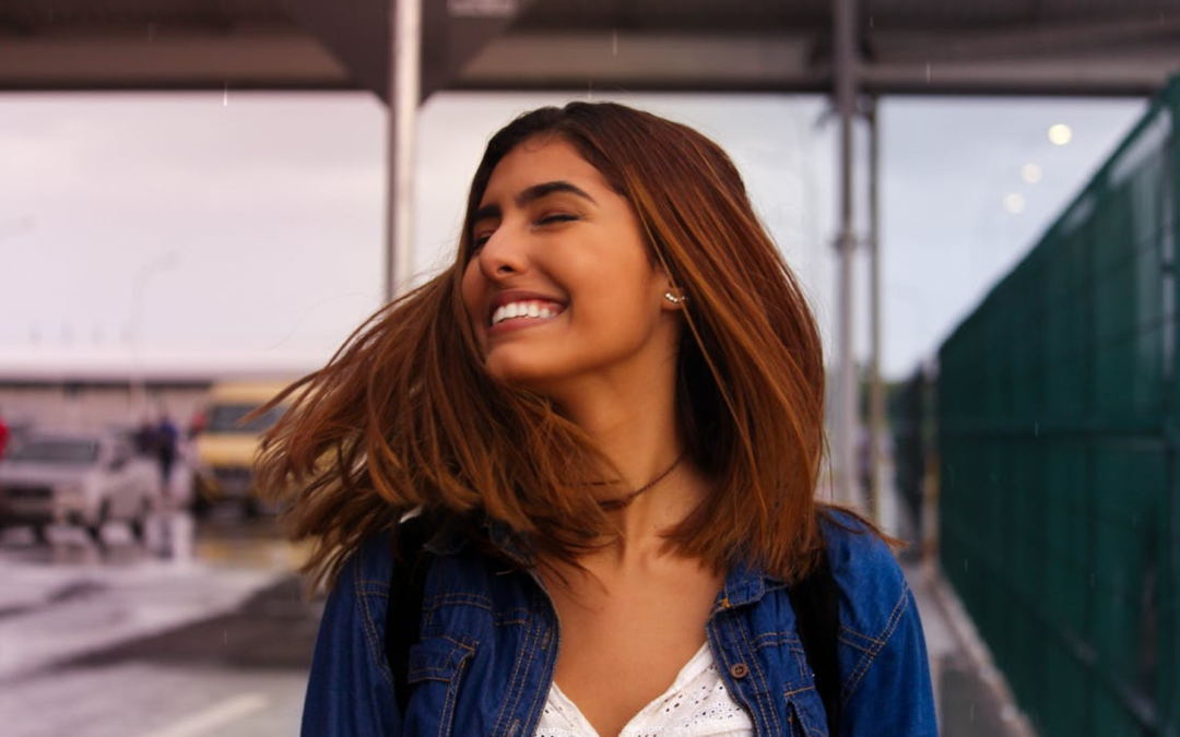 Girl smiling after taking 6 month smile treatment in NW Calgary