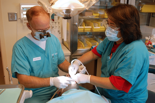 Emergency dentist performing surgery in NW Calgary
