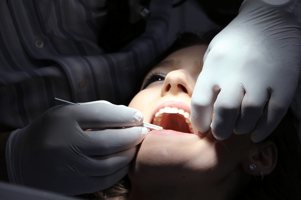 Emergency dentist treating patient in NW Calgary